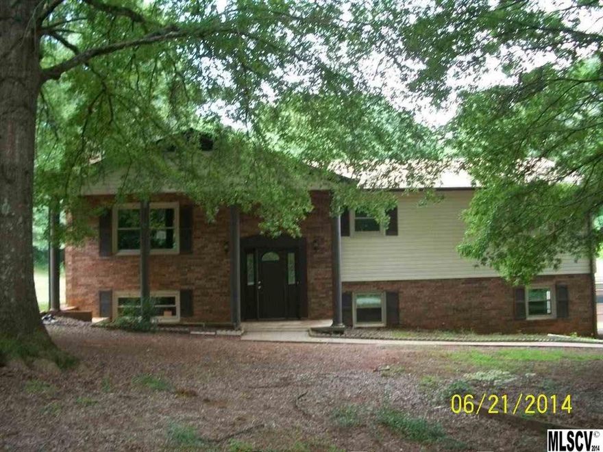 3 Bedroom, 2.5 Bath split foyer on 1.4 acres. New flooring and freshly painted interior. Large living room, dining area in kitchen and nice deck in back overlooking private backyard. Basement is finished, den with brick fireplace, kitchenette, partial bath and laundry room. Extra room in basement would make a perfect office or playroom and has exterior access.  Sgl garage and double carport. Storage buildings also on property. Must see! Won't last long at this price.