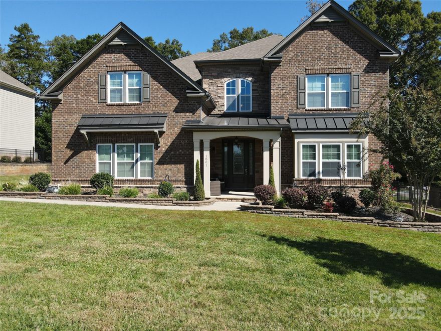 Are you ready to unlock the next chapter in luxury living? Welcome to 1801 Cavaillon Drive in beautiful Waxhaw.

This exquisite property features an expansive open floor plan, boasting 5 bedrooms and 4 bathrooms. The heart of the home is the gourmet kitchen, complete with top-of-the-line stainless steel appliances, granite countertops, and a large island that is perfect for both cooking and entertaining. Adjoining the kitchen is a cozy yet spacious family room, featuring a beautiful fireplace and plenty of natural light streaming through large windows.

The Owner's Suite is a true sanctuary, offering a generously sized bedroom, a luxurious ensuite bath with a soaking tub, a separate walk-in shower, and dual vanities. The custom walk-in closet provides ample space for your wardrobe and accessories. 

The backyard is truly a paradise. It features an In Ground Pool, Hot Tub and a Green House.  This home has a large shop that can be used as a garage, storage room or a Pool House.