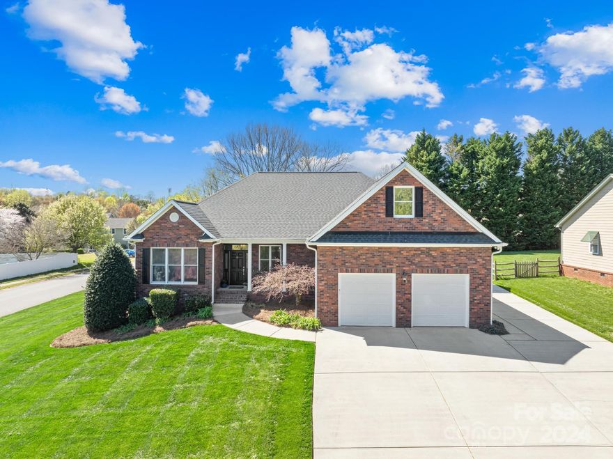 Discover the charm of this captivating full-brick exterior nestled on a corner lot.

Embrace a serene lake lifestyle with a short 5-minute drive to Jetton Park. Indulge in post-water escapades with a mere 7-minute drive to the vibrant shopping/dining scene of Birkdale, or opt for a stroll on McDowell Creek Greenway located moments away. Perhaps, spend the evening lounging on your deck where exterior 12-volt uplighting gracefully illuminates the surroundings.

Relax in the main-floor primary bedroom, where a custom dream closet awaits, designed to captivate hearts of shoe enthusiasts with thoughtful organization and ample storage. Elevate movie night in the Media Room, featuring tiered seating, projection screen TV, and immersive surround sound.

Automotive aficionados will find a haven in an expansive heated/cooled workshop. Equipped with an Eagle 9,000lb asymmetrical 2-post lift, hot/cold water supply, hanging cabinets, and pre-plumbed for an exterior air compressor.