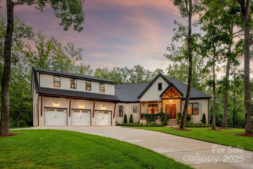 NEWER Luxury ranch w/ resort backyard situated on 1.16 acre lot. Built in 2022, kitchen includes custom ceiling height cabinetry, quartz tops, marble backsplash, commercial gas range w/custom hood, pot-filler faucet & large walk in pantry. Primary suite includes a luxury bath w/vessel tub, oversized tiled walk in shower w/frameless glass door & marble tile floors & surround. Main floor also features 2 additional secondary rooms each w/a large walk in custom closet. Main floor also includes a stunning sunroom with vaulted ceiling & custom built in cabinetry. Upstairs features a spacious bonus room + an additional guest suite with full bath & a large walk in attic. The real gem of this property is the amazing outdoor spaces including a large covered porch with wood burning fireplace and outdoor kitchen with built in gas grill, Green Egg & convenience fridge. Beautiful heated salt water pool w/expansive travertine pool deck. Backyard also features a professionally installed putting green.