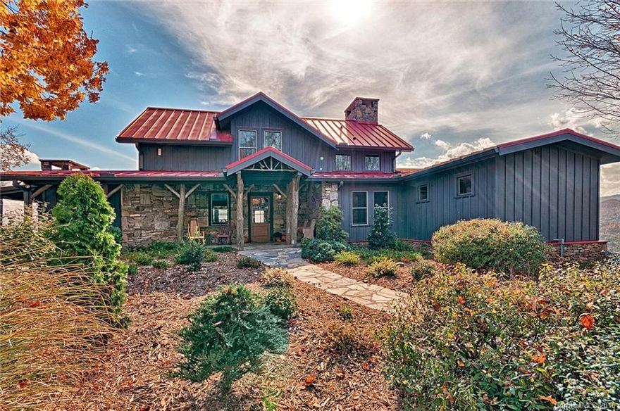 Grand Post & Beam home sited with in a Gated community. Incomparable long range views of the vistas beyond including the French Broad River. Sited on 33+ gently rolling acres with full renovations for the sophisticated buyer. Offering off the grid solar system for entire home.  Inviting Main level master suite with exquisite walk in closet and master bath.3 additional En suite bedrooms. Live harmoniously with nature in an inspiring setting, with guest cottage and gardens.