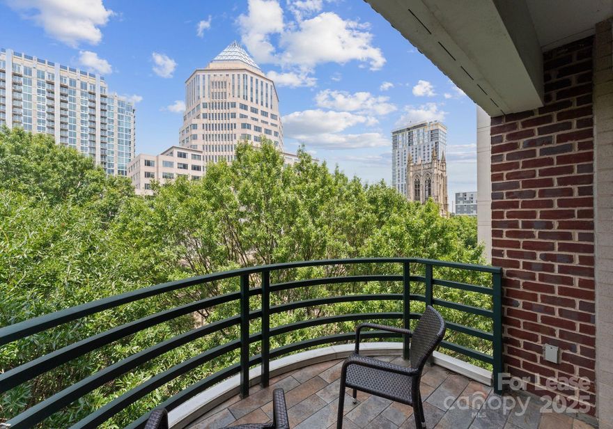 Live in the heart of Uptown Charlotte in this beautiful, sunny 4th floor end unit located in the iconic 400 North Church building. Take the elevator up to this rare & desirable 2-bedroom, 2.5-bath condo that offers an open, flowing floor plan with high ceilings, solid hardwood floors, & abundant windows that fill the space with natural light showcasing stunning urban views. Kitchen features stainless steel appliances & flows seamlessly into the living & dining areas—perfect for entertaining. Enjoy 2 spacious outdoor patios—one off the main living area & another  off the primary bedroom—an uncommon luxury in the city. Upstairs, the bedrooms are generously sized, offering comfort and quiet away from the main living space. Situated in Charlotte’s charming Historic Fourth Ward, your walkable, active lifestyle awaits with top restaurants, bars, parks, museums, sporting events, & Lynx Light Rail just steps away. This is city living at its best—stylish, spacious, & right where you want to be.