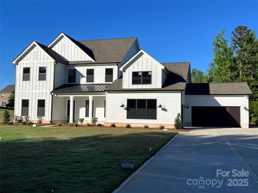 Modern Farmhouse Luxury Home at Bretagne in Fort Mill!  Great location, low taxes, with convenience to schools, shopping, and restaurants - close to Ballantyne and just 30 mins to Uptown Charlotte! The Hampton offers 4000+SF and unsurpassed amenities! Spacious main level primary suite & luxe bath with designer tile, freestanding tub, large shower, double vanity, water closet & a huge walk-in closet!  Gourmet KT with 48" double oven gas range, quartz counters, oversized island, walk-in pantry; great rm with fireplace & panoramic 12' sliding glass doors lead to screened porch; the study, guest suite, drop zone and laundry complete the main level.  Upstairs, find 2 add'l bedrooms, 2 baths, plus storage, bonus room & flex room that could be your media room/fitness room/playroom.  Designer features thru-out - coffered ceilings, accent walls, LVP flooring & 10' ceilings w/8' doors on main level, craftsman style moldings, quartz counters in baths, upgraded lighting, plus much more!