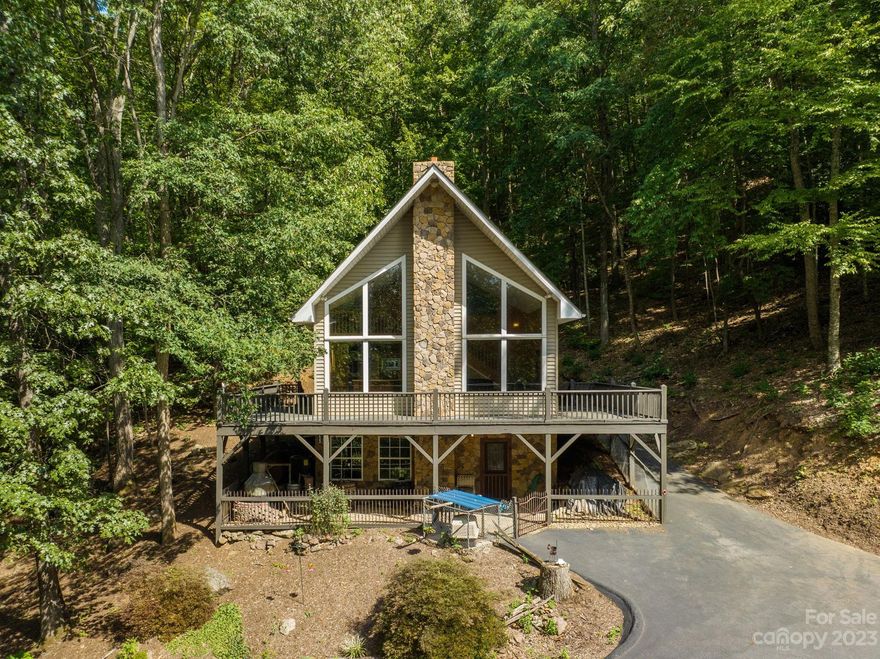 Investor Opportunity!! There are 2 Homes included in this Sale, Live in one and Short or Long Term Rent the other or Rent Both!!
Experience tranquil off-grid living in Candler, NC, surrounded by majestic trees yet still part of a warm community.

Highlights:

- Sustainable, off-the-grid technology.
- Serene acreage for privacy.
- Direct access to hiking trails.
- Mobile home(655 sq. feet) for guests or income.
- Sub-Zero appliances.
- Ample parking and storage.

This retreat offers the perfect blend of nature, sustainability, and neighborly connections. Don't miss this rare opportunity! Schedule a viewing today and make it yours. The mobile home is included, ideal for visitors, family, or short-term rentals. The Main House(3/2) is listed separately at MLS # 4066818