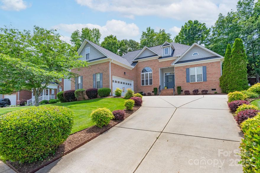 This beautifully maintained home filled with updates has everything you’ve been looking for.  Ask to see the list of updates!! An open floor plan, new hardwood floors, and fresh paint create a warm, inviting space perfect for everyday living and entertaining. The elegant primary suite features a huge walk-in closet and private access to the rear deck. Upstairs offers a full bedroom, bath, and bonus room ideal for guests, in-laws, or a home office. You'll love the massive walk-in attic and oversized side-load garage for extra storage. Step outside to a large deck that overlooks a private, beautifully landscaped backyard with full irrigation in the front and back. Whether you're enjoying a quiet morning coffee or hosting weekend get-togethers, this outdoor space delivers.  Located just a short walk to the community pool and minutes from I-77, shopping, and restaurants, this home combines comfort, style, and convenience. Don't miss your chance to make it yours!