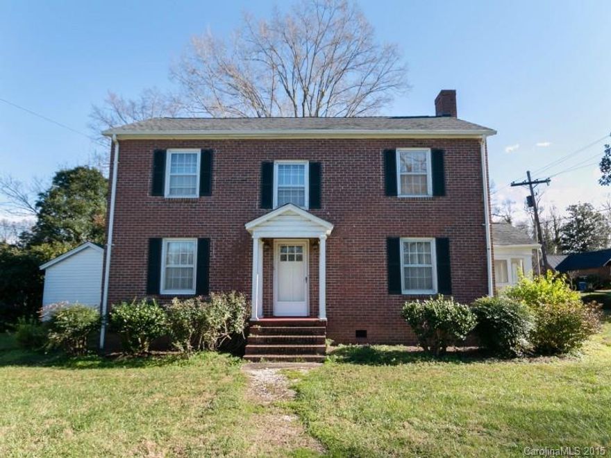 Awesome investment opportunity! Charming historic brick home that is ready for your personal touch. 2 story home with 4 bedrooms on almost half an acre corner lot! Hardwoods in all bedrooms. Large living room with fireplace. Formal dining room. Spacious Master Bedroom. Unheated sun room. Unfinished basement area. Enjoy fresh air on the screen porch. Home also features detached garage with storage area. Don't miss out, this home is priced to sell!