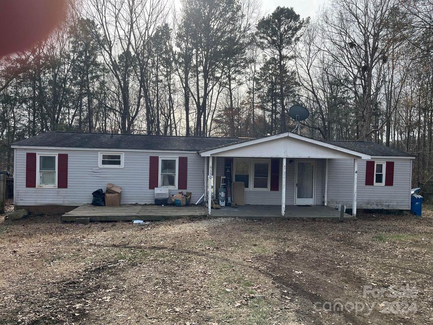 A double wide manufactured home that sits on almost a half of an acre. Requires a lot of work but has a lot of potential.