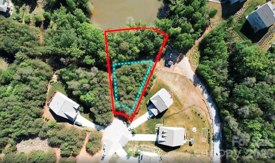 RARE opportunity to own a dockable waterfront homesite in the highly desirable Edgewater community on Fishing Creek Lake. This approximately 0.60-acre lot offers exceptional year-round water views and an ideal topography for a walk-out basement, leading to a level backyard just steps from your future private dock. Positioned in a quiet cul-de-sac, the setting provides both privacy and a strong connection to the surrounding natural landscape.

This 45 ft by 200 ft waterfront homesite provides ample space for a custom residence, outdoor living areas, and functional yard space. Conveniently located between Charlotte, NC and Columbia, SC, with access to local dining and shopping in nearby Lancaster.

You Can Now envision your New home w Unobstructed Lake views from your back porch for your true Enjoyment. Edgewater Golf Club offers 18-hole(with an additional 9-soon), marina, clubhouse, tennis & pickleball courts, bocce ball, walking & biking trails, outdoor pool, & scenic waterfront pavilion. 
A prime opportunity to secure a dockable lakefront lot and build a custom home in one of the region’s most sought-after communities. Moreover, the property's proximity to Downtown Lancaster, Short drive from Charlotte, NC or Columbia, SC - eat locally at Wagon Wheel or Flopeye Diner. Picture building Your Dream Home TODAY!  **Dont forget to watch the Video**
