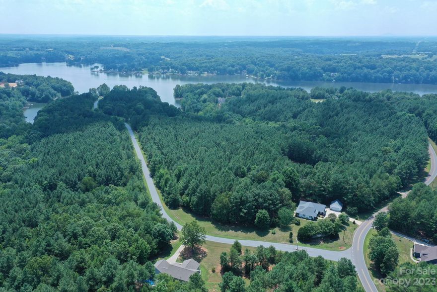 Fantastic 1.5 acre lot located in Riverwalk - one of our area's best kept secrets. This private, gated, LAKE ACCESS community has so much to offer! Riverwalk features a community beach with a picnic area, community boat ramp, community dock with daily boat slips for community use and a boat/RV storage lot. Build your dream home on this wooded lot!  Great location - Just minutes from 1-40 with easy access to I-77, Charlotte, Hickory and Statesville.