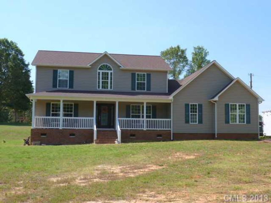 Drastically Reduced! Below market and accessed value! Seller Motivated to Sell! Beautiful custom home sitting on 2 acs. Has it all, 3 BR's, 3 BA's. This 2- story home has 1 BR on the main, comes with a full kitchen has stainless appliances, breakfast bar, custom cabinets with pull outs. Beautiful Red Mahogany HW flrs throughout. Lg family room that opens to the foyer and lg country front porch.