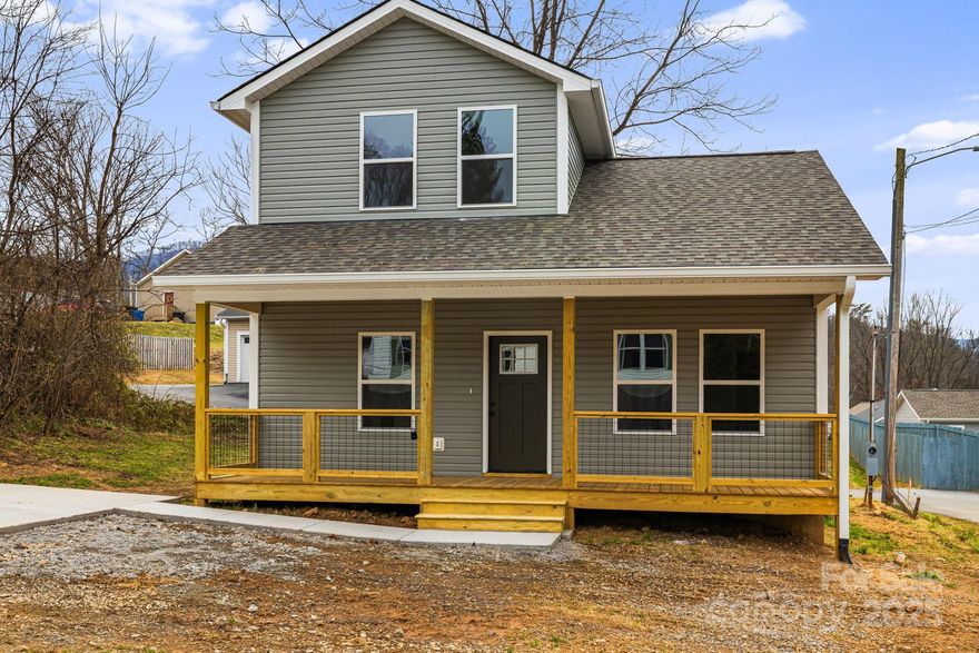 Come home to Waynesville! This new construction home features a total of 3 bedrooms and 2 full baths. A covered front porch and back deck provide easy access to the outdoor areas. Main level living with the Primary Bedroom and en-suite bath, Laundry and common areas on the main floor, with 2 additional bedrooms and 1 full bathroom on the upper level. Just off the kitchen is the laundry/mud room with exterior access to the back deck. The kitchen features hard surface counters, plenty of cabinets, all new kitchen appliances that convey with the home and a convenient pantry! The home is located very near the walkable and historic Main St area of Waynesville which features numerous great restaurants, breweries and shops. Just a few minutes away are Historic Frog Level, the Hazelwood area (more shops and restaurants) and you're centrally located for great access to lots of outdoor activities (fishing, camping, hiking) - Cherokee, Cataloochee and the Great Smoky Mtns National Park are all short drives away. Just around the corner is one of several public parks/playgrounds that are easy to access. Construction complete and this one is move-in ready! Final tax value TBD. You can take a virtual tour here: https://my.matterport.com/show/?m=B4kdFxraJrE&