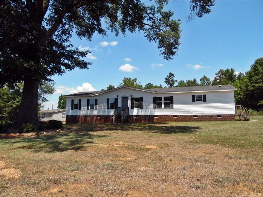 Spacious brick underpinned doublewide mobile home on a large acre lot features an open kitchen with work island, formal dining, large family room, and split bedroom plan.  Cedar-lined closets and plenty of storage options.  Lots of sqft for the money in this inviting home!  Strongly encouraged that offers include proof of funds/pre-approval & is required for seller's final acceptance.