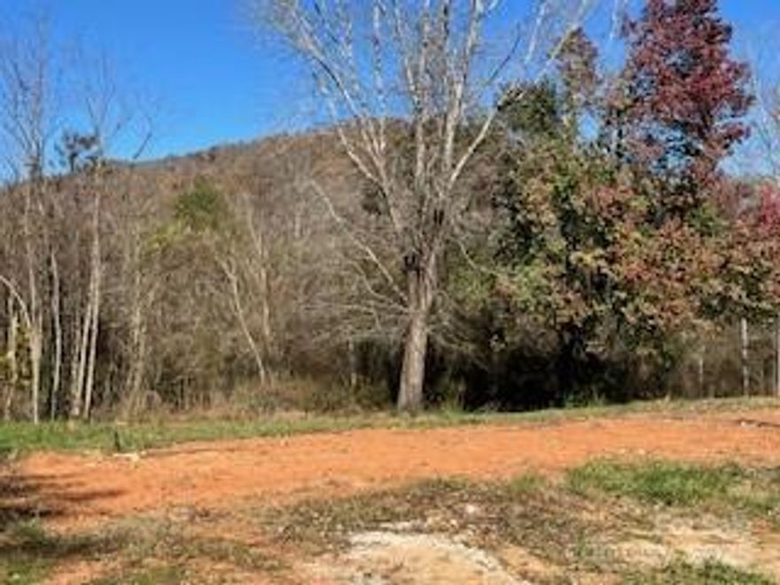 This hard to find lot is READY to Go , old mobile removed . All utilities in place, pull in your camper your , manufactured home or just build .Lots of options. Good area for a garden with a creek for irrigation , Possible spring on property. Great location ,Supper handy to I-40 . Call TODAY.