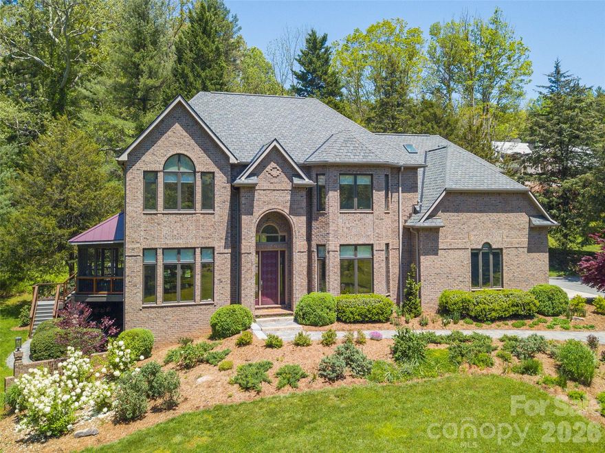Behind the gates of The Ramble—yet free from HOA restrictions—this elegant brick estate offers the rare blend of luxury, privacy and convenience. Nestled on 2.455 acres bordered by Dingle Creek, the property is a private oasis just minutes from downtown and S. Asheville amenities. An open design welcomes you with soaring ceilings, a sweeping staircase and walls of windows that fill the space with natural light. The renovated kitchen boasts Fisher & Paykel appliances and refined finishes. A stunning primary suite features a tray ceiling, spa-like bath and massive walk-in California Closet. Enjoy the media room, cozy screened porch and expansive back deck ideal for relaxing and entertaining. The finished lower level adds space and flexibility, and a 3-car main-level garage offers ultimate convenience. Every detail, from the quality fixtures to the peaceful outdoor setting, speaks to timeless elegance and exceptional craftsmanship in one of Asheville’s most exclusive enclaves!