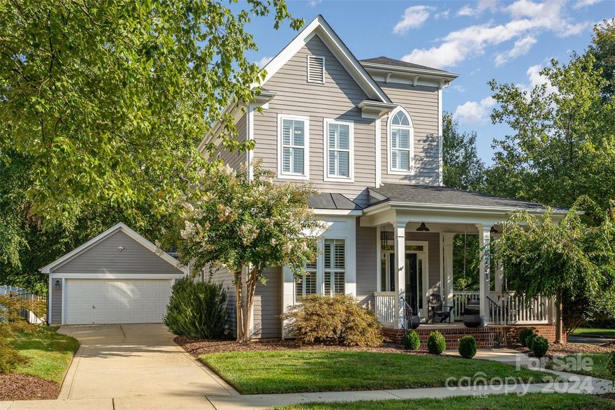 This Birkdale Village home is a must see. A perfect location on a fully fenced corner lot on a quiet street. This is a rare lot in Birkdale Village that backs to green space. It is a quick stroll to Birkdale Village, and several of the neighborhood pocket parks, or the Greenway Trail. The large front porch welcomes you to this beautiful Victorian style home where inside, you will find a nicely updated galley style kitchen, hardwoods throughout the entire home,
updated lighting and plantation shutters throughout the home. Tastefully finished with neutral paint and beautiful on trend wallpapers. Primary suite upstairs with 2 additional bedrooms that share a Jack and Jill bath. Yes, the beautiful porch swing conveys! Garage is finished and has epoxy floors plus additional storage above accessed by pull down stairs. Neighborhood has pool, tennis courts and pocket parks. Quick trip to Robbins Park, Lake Norman and boat clubs.