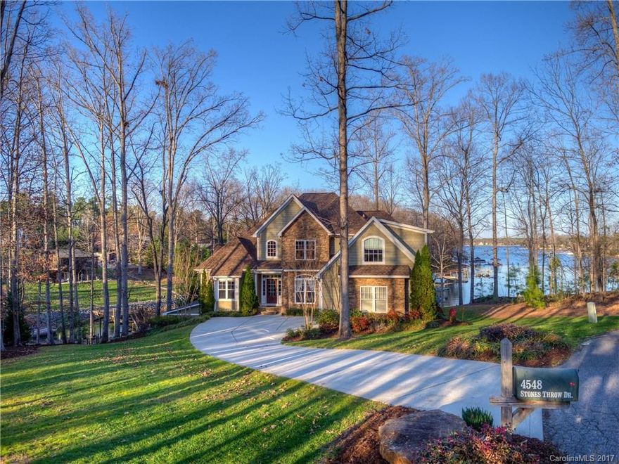 Get on the Lake Today!  A wall of windows along the back capture breathtaking views of Lake Norman.Private pier and dock ready for your boat! Beautiful Main lvl master, huge walk in closet.Elegant GR with 2 story stone gas logs FP. Lower level rec rm,wet bar and hot tub steps away! Huge eat in Kitchen w/Keeping rm, fantastic for entertaining. Huge deck ready for your grill and evening dinner parties. This home has 5 bedrms! Tons of storage plus a workshop in the basement! This one has it all!