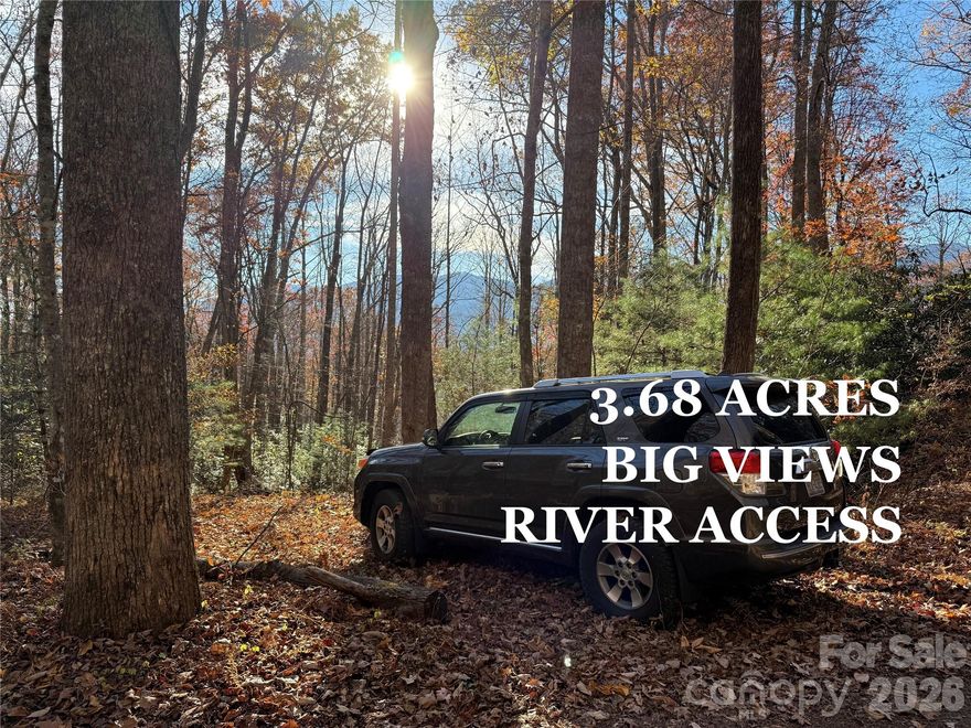 This property has it all! An insanely beautiful POA common area on the South Toe RIVER with great little trails...the PRIVACY of a magical mountain laurel, rhododendron, and hardwood forest...and extreme VIEWS of the Black Mountain Range with clearing!! Great usable land throughout---level to gently sloping with a small stream running along the southern boundary. Perfect location for the outdoor enthusiast. Imagine walking out your front door and taking a short stroll down to the river for some fly fishing, or just kicking back and soaking your feet. Abundant hiking trails are nearby and it is only a short drive to the Blue Ridge Parkway. Love art? Check out a Toe River Arts studio tour or head over to Penland School of Crafts for the day. Great shops, restaurants, and groceries are in the nearby towns of Burnsville and Spruce Pine. Minimal restrictions to protect your investment and super low HOA fee - currently $100 annually. This tract has a lot to offer at a great price - over $25k under tax value! Schedule a tour with your agent and get out to see this gem for yourself!