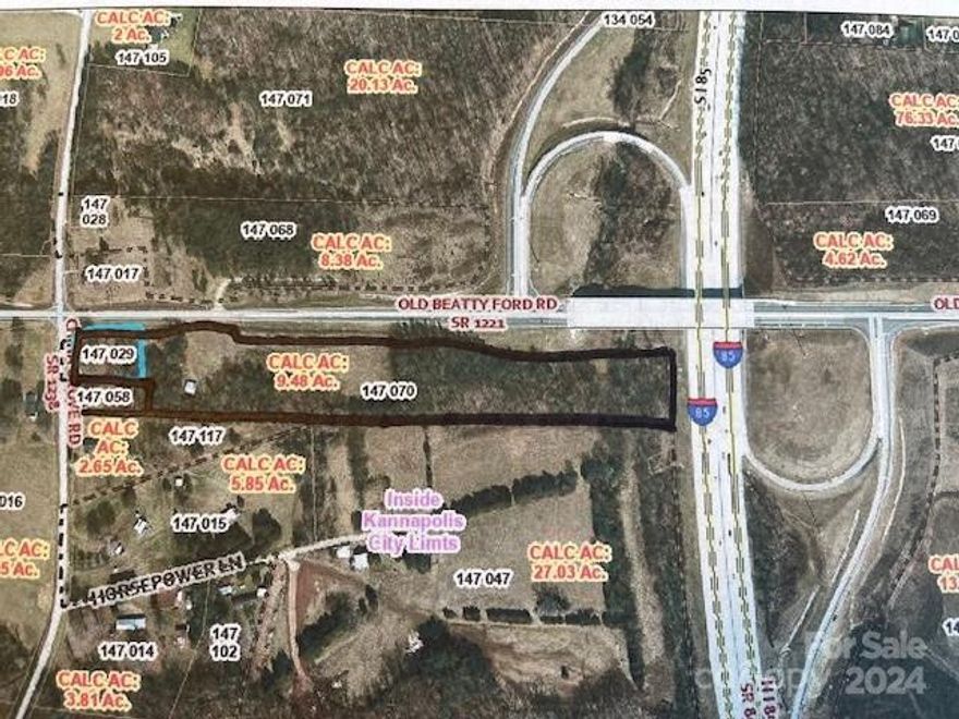 Attention Developers!!!!! 10.32 acres directly off Interstate 85, Old Beatty Ford Exit 65. Includes two parcels, 147029 & 147070.  It is in Rowan County and has a China Grove address but was annexed into Kannapolis City. Currently the property has a RA zoning and will have to be rezoned. Currently does not have water and sewer hook up with Kannapolis, but seller is advocating for this.  Potential development is in its future. This is prime interstate property and access.   There is a creek on the back of the property. There is a house and barn on the property. Please do not trespass without an appointment.