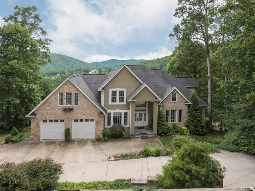 Custom home w/ abundant designer detailing offers a great location between Asheville/Hendersonville, pond, mountain, & golf course views, & flexible living options for indoor & outdoor enjoyment. Tranquil scenery & natural light flows into the comfortably sized rooms. 2 decks look over the 16th tee. Crown molding, hardwoods, 2 rock fireplaces plus coffered & cathedral ceilings. Guest suite, 2nd kitchen & family/flex room on lower level. Convenient to clubhouse, pool, playground & tennis courts.