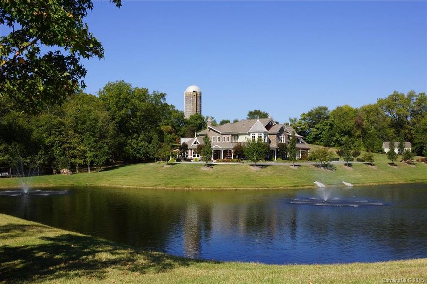 Acreage/Estate Home on 10+ ac. Breathtaking hand-milled wood finishes including wainscoting, flooring, cabinetry, doors, window casings and more.  Natural stone features bring the outdoors in with amazing natural light flowing thru the abundant windows. 4BR,5BA,2 1/2BA, All Electrolux appl, Control 4 system, Surround Sound, wine cellar. Wrap around porch overlooking lg spring fed stocked pond. Private setting creates your very own personal retreat.  View Google Earth Map:  https://goo.gl/vBKhmW