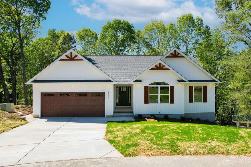 Unique brand new custom construction in Tega Cay! Golf course and lake views. This won't last long!