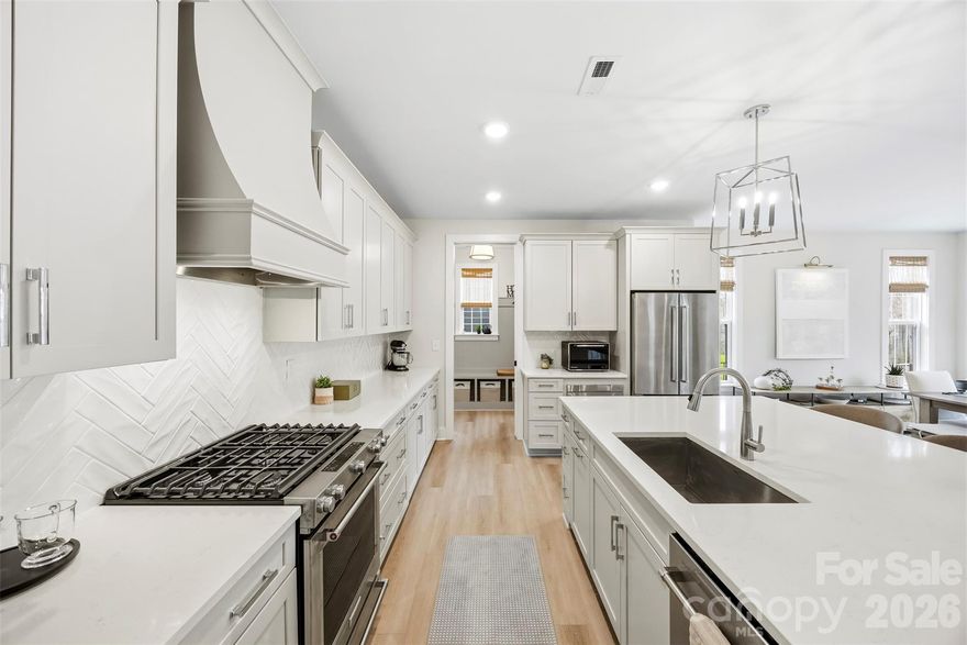 Better Than New Construction — No Wait, No Extra Investment Required! MUST SEE Premium Lot with Fully Completed Outdoor Living in desirable Matthews Ridge Reserve.

Welcome to 2723 Ritz Lane — where modern luxury meets timeless design in an exclusive community by Kinger Homes. With only 31 thoughtfully crafted single-family homes, this intimate neighborhood offers a rare blend of privacy, upscale living, and convenience.

Why wait for new construction when this home already has it ALL? Meticulous owners have invested significantly to elevate this home beyond builder grade — saving you time, money, and hassle.

Upgrades & Improvements Include:

Expansive 19'x16 'screened-in porch
Extended paver patio for seamless indoor-outdoor living
Fully fenced yard
Professional landscaping
Epoxy-coated garage floors
Custom closet systems

Step inside to a completely carpet-free interior featuring sought-after wide plank flooring (9x20) throughout, delivering a clean, modern, and cohesive feel. The open-concept layout is ideal for both everyday living and entertaining.

The designer kitchen is a standout with a custom vent hood, oversized island, walk-in pantry, and ample prep space — flowing effortlessly into the spacious family room. A sleek linear electric fireplace with modern slat trim creates a stunning focal point.

The main level includes a guest bedroom and full bath with walk-in shower, perfect for multi-generational living or visitors. Upstairs, enjoy ensuite bedrooms for ultimate privacy, plus a versatile bonus room/flex space ideal for a home office, media room, or playroom.

Step outside and experience true indoor-outdoor living — relax or entertain year-round on your screened porch and extended patio overlooking the beautifully finished backyard.

Located just minutes from shopping, dining, and entertainment, this home offers both luxury and lifestyle in one of Matthews’ most desirable newer communities.

Move-in ready. Upgraded. Better than new construction.