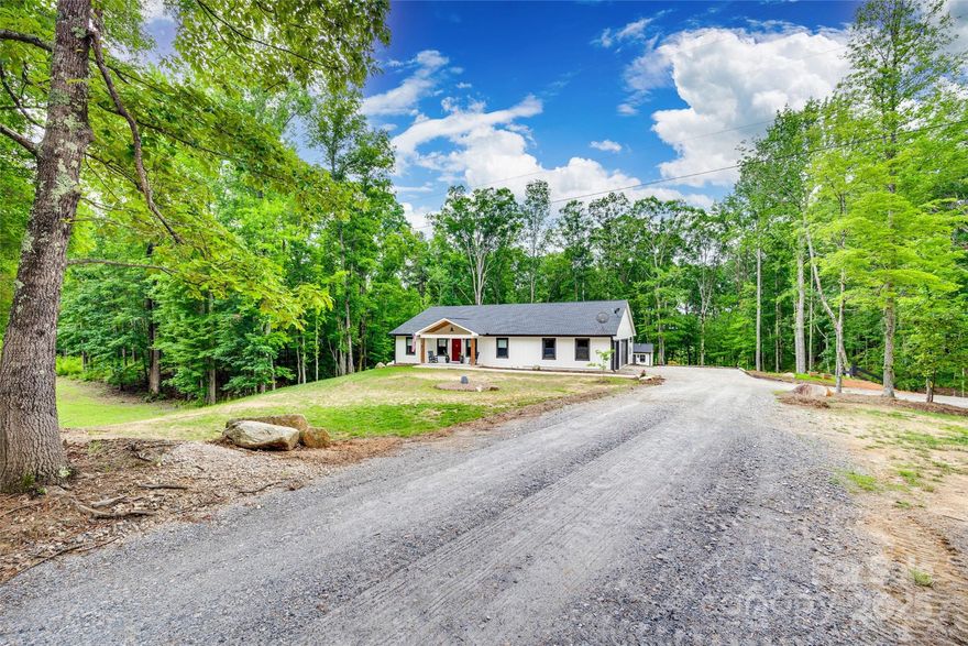 Experience the luxury of country living! Capture the private serenity of this charming custom home surrounded by approx 7 acres of wooded canopy. A beautiful tree lined entrance is just the beginning. You’ll love the Great Room vaulted wood ceiling & adjoining gourmet kitchen showcasing the large island/breakfast bar, quartz counters & open shelving+ a dream walk-in pantry! Primary en-suite boasts a stunning, luxurious spa-like walk thru shower! Lounge by the cozy fireplace or relax in the hot tub relishing nature’s tranquil beauty on the screened porch. Built-in grill+ an amazing bar/recreation room- perfect for entertaining! Farm-to-table enthusiasts can harvest home grown vegetables in a fenced garden with irrigation & preserve them in a unique root cellar! Gather fresh eggs from the impressive chicken coop with metal roof & self feed/water system. Detached building includes workshop, studio, full bath with mini split HVAC+ storage. Your private retreat awaits you. Welcome Home!