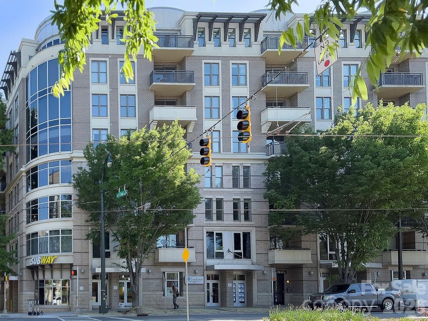 Welcome to this beautifully updated condo in the heart of Uptown Charlotte, where location, lifestyle, and modern upgrades come together in perfect harmony. Situated in a secure building with assigned covered parking in a gated parking deck, this condo offers both peace of mind and convenience. The unbeatable Uptown location puts you within walking distance to everything the city has to offer—dining, nightlife, Panthers Stadium, Hornets Arena, Knights Baseball, Blumenthal Theater, parks, greenways, and more. Plus, with easy access to I-77 and the Gold Line streetcar stop right out front, commuting and exploring the city has never been easier. Recently fully updated, this move-in-ready home features new luxury vinyl plank flooring and modern lighting throughout, paired with a brand-new HVAC system installed in 2024 for year-round comfort. The open floor plan offers a seamless flow from the kitchen to the living area, perfect for entertaining or relaxing. The kitchen is fully updated with granite countertops, an undermount sink, a breakfast bar, sleek subway tile backsplash, and stainless steel appliances including the refrigerator. The bathroom has also been completely renovated, featuring a new vanity, tile flooring, a beautifully tiled tub surround with niche, and glass shower doors for a clean, modern look. Step outside to your own private covered balcony overlooking the courtyard and community pool, offering a peaceful outdoor retreat in the middle of the city. The spacious primary bedroom boasts both a walk-in closet and a second closet, providing ample storage. Washer and dryer convey, and 2” blinds are installed throughout, adding both style and privacy. This well-maintained community offers resort-style amenities including a community pool, clubhouse room, and an incredible rooftop terrace with TV, gas grills, a firepit, and stunning views of Uptown Charlotte—ideal for relaxing or entertaining guests. Whether you’re a first-time homebuyer, urban professional, or investor, this condo is the perfect opportunity to enjoy a vibrant city lifestyle with modern comforts. With all the major upgrades already completed and a location that’s second to none, this home is truly move-in ready. Don’t miss your chance to own a stylish, updated condo in one of Charlotte’s most desirable locations!