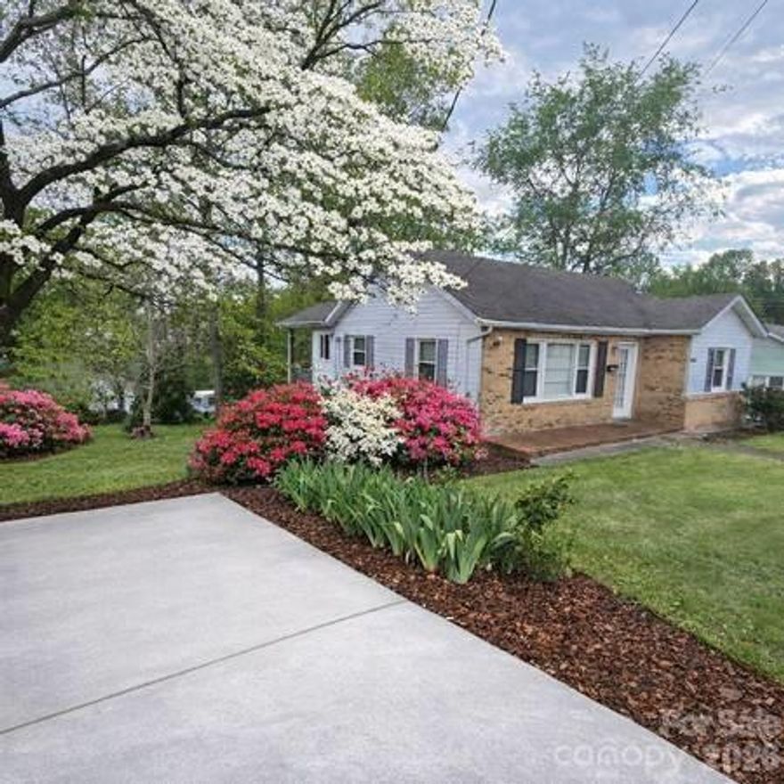 Classic Charm Meets In-Town Convenience:
Discover the perfect blend of original character and modern reliability in this lovely Marion home. Located within city limits, you are just a short stroll away from the vibrant shops of Downtown, East McDowell Middle School, and the scenic Peavine Trail.
Inside, you’ll find original hardwood floors throughout the main living areas, complemented by durable tile in the kitchen and bathroom. Peace of mind comes standard, as the windows and high-efficiency heat pump were updated in 2010.
Key Highlights:
Outdoor Living: A spacious, shaded backyard for relaxing or starting that garden you’ve always wanted.
Bonus Storage: A bright, walk-out concrete basement with two entrances—currently used for seasonal storage.
Move-in Ready: Includes a newer washer/dryer set and a brand-new garbage disposal (installed Spring 2026).
