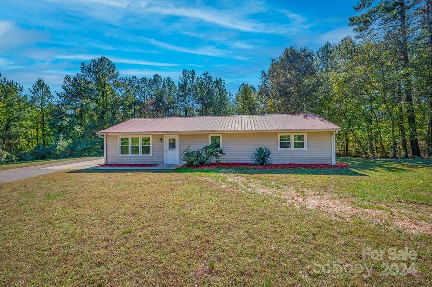 Beautifully remodeled 3-bedroom, 2 full bath ranch-style home, nestled on 1.37 private acres! This home offers a modern, open-concept layout that features stunning tiled showers, sleek granite countertops, brand-new appliances, and beautiful luxury vinyl flooring. The private setting provides the perfect blend of tranquility and convenience, making this home the perfect retreat. Don’t miss the chance to make this move-in ready gem your own!