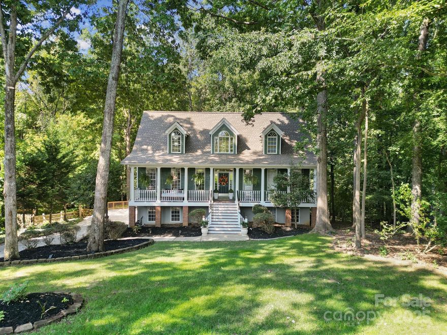 This beautiful basement home is perfectly set on a picturesque lot in one of Fort Mill’s most desirable communities. Blending timeless Southern charm with modern updates, it features fresh interior paint, new flooring throughout, and thoughtfully refreshed kitchen and bath spaces that create a bright, inviting atmosphere. A wide front porch welcomes you inside, where the main level includes a comfortable primary suite offering ease and privacy. Upstairs, an additional bedroom with generous proportions could easily serve as a second primary suite, ideal for guests, in-laws, or multi-generational living. The finished basement adds exceptional versatility with open areas for entertaining, a home office, gym, or media space, along with excellent storage options. Outdoors, mature landscaping and a private backyard provide a peaceful setting for gatherings, gardening, or quiet relaxation. Located close to top-rated Fort Mill schools, shopping, dining, and major highways easily accessible. This home offers the perfect balance of comfort, convenience, and character. With its flexible floor plan, thoughtful updates, and inviting curb appeal.