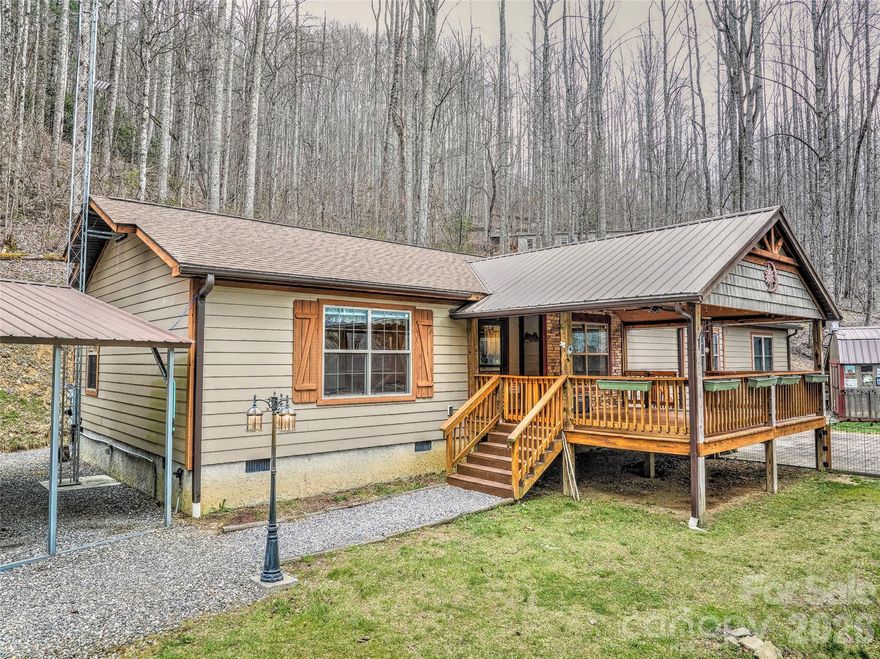 Tucked away at the end of the road in the Conleys Creek community, this secluded home offers the perfect blend of privacy, space, and functionality for a full-time retreat or peaceful getaway. The open floor plan features dual primary bedroom suites, a double pantry, and generous living areas that open onto spacious front and back decks—ideal for enjoying the serene surroundings. Outside, you’ll find an RV carport, two outdoor storage sheds, and a fenced pet area conveniently accessible from the primary bedroom, along with additional outdoor storage. The property is meticulously maintained, exceptionally clean, and thoughtfully organized throughout. Enjoy the soothing sounds of a bold creek and the rare tranquility of living just steps away from the Nantahala National Forest.