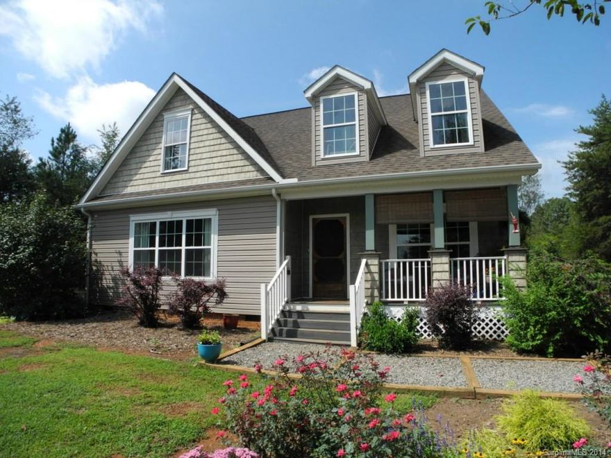 Don't miss this one! You have 4 acres, walking trails, natural area & garden beds; the home features 2300 sqft, wood floors, soaring ceilings, contemporary styling and just beautiful throughout. The upstairs is all bonus! A huge 14x26 bonus room, office & another bedroom. There is also a 18x19 walk in attic area for all your storage needs! You are located in the country, on a private road, very quiet area, low county taxes only & still just minutes from Lincolnton. I have 100% financing options!