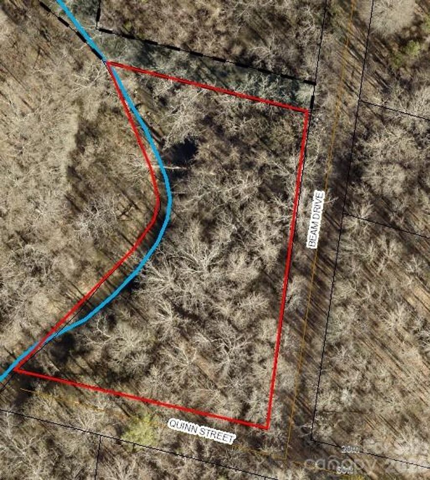 Discover the perfect opportunity to build your dream home on this beautiful 1.04-acre wooded parcel located in the heart of Shelby! Tucked away on a quiet gravel road, this property offers privacy, natural surroundings, and endless potential. Mature trees provide a serene setting, while the peaceful Hickory Creek at the rear of the property adds charm and a relaxing backdrop.

Enjoy the best of both worlds by getting a peaceful, country-style living while still being right in the city. Conveniently located just minutes from local shops, dining, and everyday essentials, you’ll have easy access to everything you need without sacrificing tranquility.

With convenient access to nearby highways, this location also offers the option to commute to surrounding areas, including Charlotte.

Looking for more space or an investment opportunity? The .58-acre parcel located directly across the street is also available for purchase. Buy one or both to expand your vision and create a larger homesite or investment package.

Whether you’re looking to build now or invest for the future, this lot offers the ideal blend of seclusion and convenience. Bring your builder and vision because this is your chance to create a custom retreat surrounded by nature.
