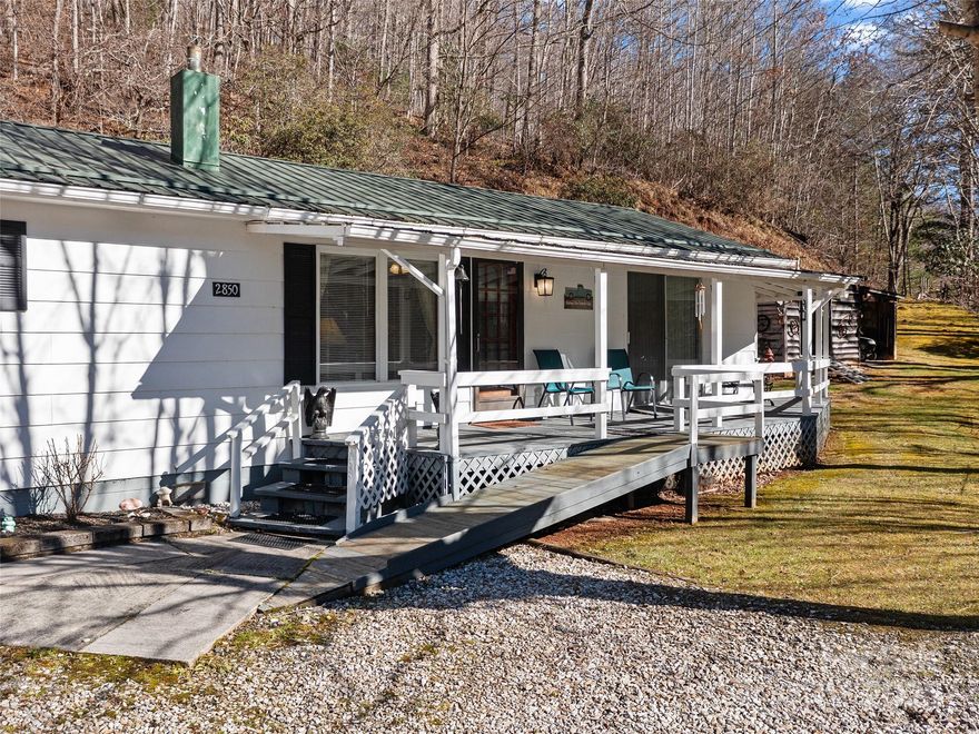 Located along the Avery/Mitchell county line, this well-kept single-wide mobile home with an addition offers peaceful wooded surroundings on nearly an acre of land to allow its new owner to "live simply". Thoughtful improvements, including durable hardboard siding on the exterior, give the home a more refined and ranch-style feel. Inside, the layout is comfortable and functional, featuring 2 bedrooms and 1.5 baths, along with a welcoming living room that flows easily into the dining area and kitchen. Large windows invite natural light and views of the trees, creating a cozy retreat that blends privacy with convenience. Whether you're looking for a full-time residence or a mountain getaway, this charming property provides a quiet setting with the essentials already in place and room to make it your own.