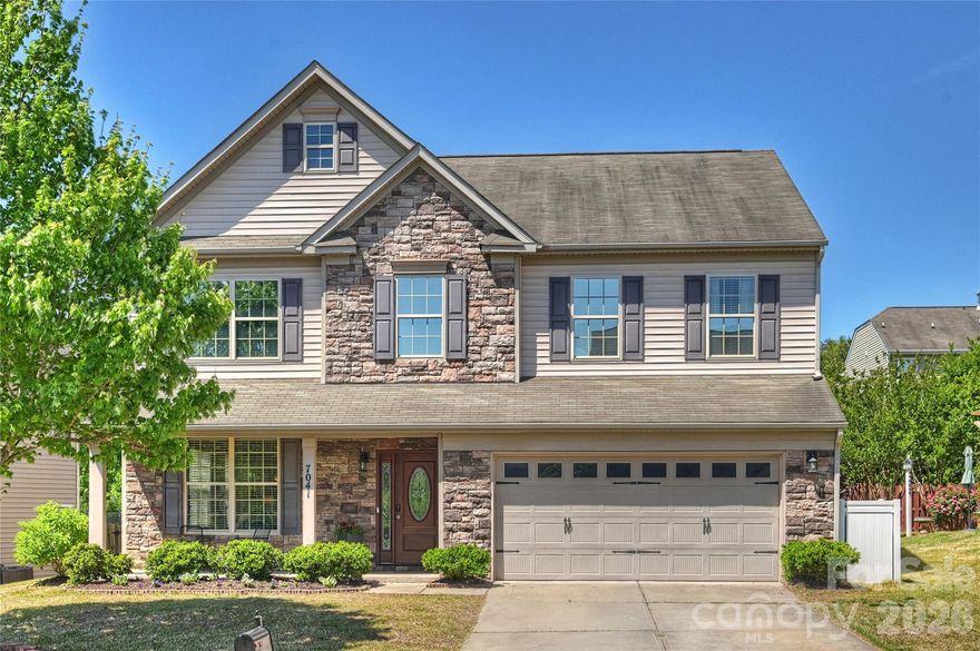 ALMOND GLEN... Offers Neighborhood Pool, is 1/2 mile from Charlotte Soccer Academy, and only 2 miles to Carolina Place Mall Shopping, Dining, Entertainment and Medical Areas!!! You can't get much closer to NC. Pride of Ownership Shows in this 4 Bedroom, 2.5 Bath Home w/Crown Molding On Main Level & Beautiful Hardwood Floors! Spacious Living Room Opens to Well-Appointed Dining Room w/Tray Ceiling, Chair Rail Molding & Handsome Wainscoting Below. Family Room w/Elegant Gas Fireplace Overlooks Rear Landscaping & Opens to Stunning Kitchen & Fenced Backyard w/Patio, Making Entertaining A Breeze! The Large, Open Kitchen is a Cook's Delight w/Stainless Appliances Including 5-Burner Gas Stove & Microwave... Custom Tile Backsplash & Granite Countertops... Beautiful Cabinetry... Walk-In Pantry... Island w/Storage... Counter Height Seating at Island/Service Bar + Casual Dining Area. Private Walk-In Laundry Room, 2-Car Garage. Spa-Like Primary Suite w/Tray Ceiling & Ceiling Fan... Walk-In Primary Closet w/Custom Built-Ins... Dual His/Her Sinks w/Storage... Shower + Separate Soaking Tub... & Private Water Closet. Large Flex/Bonus Space + Three Additional Bedrooms + Full Bath w/Custom Tiled Shower & Dual Sinks Round Out the Upper Level! Enjoy the Neighborhood Pool, Cabana & Sidewalks! Only Living Room was Virtually Staged. This MOVE-IN READY Home is Located in TOP RATED School Zones!