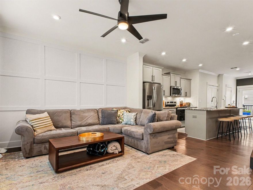 Live where Charlotte comes alive. This stylish, like-new 2-bed, 2.5-bath townhome at 2011 Federation Court puts you steps from the best of Plaza Midwood — Resident Culture Brewing, Midwood Smokehouse, Emmy Squared Pizza, Supperland, and the eclectic energy of Central Ave are practically your backyard. Inside, hardwood floors, recessed lighting, and an open-concept layout create a bright, modern living space ideal for everyday living and entertaining. The designer kitchen features quartz countertops, custom cabinetry, stainless steel appliances, subway tile backsplash, and a spacious center island — perfect for hosting. Step outside to your private balcony for morning coffee or evening relaxation. Upstairs, the primary suite offers a spa-style retreat with dual walk-in closets and a glass-enclosed shower, while the second en-suite bedroom is ideal for guests or a home office. A convenient powder room and attached two-car tandem garage driveway round out this turnkey gem. HOA covers water, garbage, high-speed internet, cable, and lawn care. At 1,313 sq ft in one of Charlotte's most sought-after zip codes — walkable, vibrant, and move-in ready ... you don't want to miss this one!!! Welcome home.