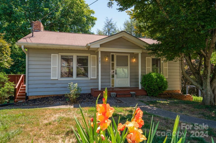 Nestled in the desirable Black Mountain area, this charming 1929 cottage exudes historic charm and modern comfort. Boasting three cozy bedrooms and two elegant bathrooms, this home is the epitome of comfort and style. The partially finished basement adds valuable extra space, perfect for a home office, entertainment area, or cozy retreat. Upstairs, gleaming hardwood flooring adds warmth and character to the living spaces, creating a welcoming ambiance throughout. With a touch of vintage allure, this cottage is a true gem, blending timeless appeal with contemporary living. Don't miss the opportunity to make this enchanting property your own retreat in the heart of Black Mountain.