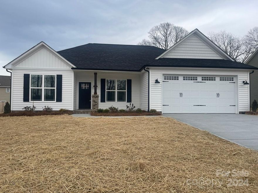 New Construction! A must-see! Gorgeous 3 bedroom 2 bath newly constructed home. This home offers a split floor plan. The primary bedroom has a gorgeous coffered ceiling, a large walk-in closet, a spacious primary bath with double sinks, granite countertops, and a beautifully tiled shower. The living area is open to the kitchen. The kitchen has beautiful wainscoting, granite countertops, and a spacious island with additional storage. Attic access is located in the spacious garage,