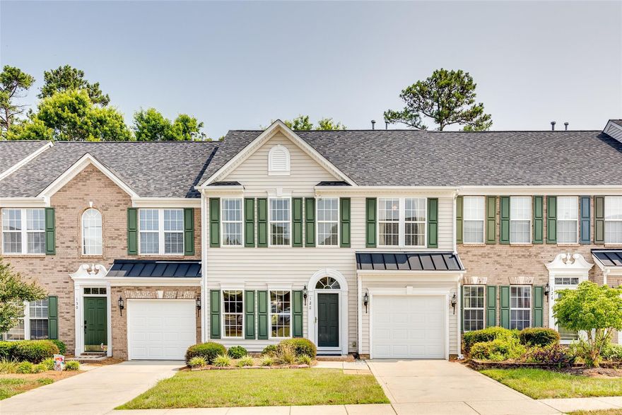 Welcome to 128 Hightide Drive. This 2 story townhouse is located in the highly desirable, lakefront community of Sunset Point. The main floor offers a semi-open concept, making it perfect for entertaining. The kitchen features a breakfast bar and opens to a dining area and to the living room. The living room is spacious has a gas fireplace. Upstairs you will find the primary bedroom and ensuite with dual vanities and an updated walk in shower. The back patio is large, private and covered, making it a great place to relax and grill out. In Sunset Point, the HOA covers  the lawn maintenance, exterior maintenance(pressure washing) and trash/recycling service. You have access to a community pool, private beach area, and a private picnic area. This community is conveniently located, just minutes to shopping, dining, medical facilities and I-77. No City Taxes.