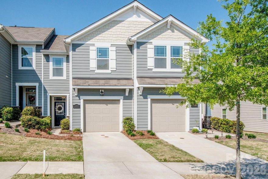 Fall in love with this immaculate, move-in ready—better than new—3 bed, 2.5 bath townhouse with private wooded views in the Magnolia Walk community. This beautifully appointed home offers an open floor plan and a bright, modern kitchen with a breakfast bar, large dining area, gas range, walk-in pantry, and granite countertops. The large family room features a cozy gas fireplace and opens to an oversized patio overlooking a serene, tree-lined yard—perfect for morning coffee or evening entertaining. Upstairs is a generous loft ideal for a home office, sitting area, or media space. The spacious primary suite includes a private en-suite bath and a large walk-in closet. Two additional bedrooms, guest bath and laundry room complete the upper level. Additional highlights include a 1-car attached garage, include lawn maintenance, in-ground irrigation, walking trails, playground, sidewalks, and streetlights.  Ideally located minutes from I-77 and I-485 for easy access to Uptown Charlotte and Lake Norman.  Location also offers nearby medical facilities, restaurants, schools, shopping, and all other necessary amenities. Exceptional condition, thoughtful layout, tranquil wooded views and ideal location make this townhouse a standout—schedule your showing today!