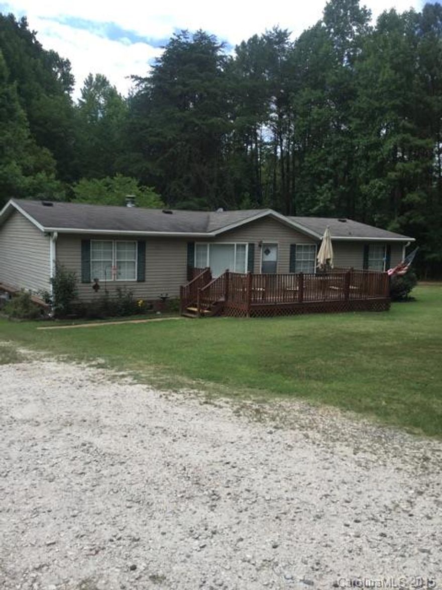 double wide home two decks fenced in backyard almost 2 acres with an additional adjacent two acre lot included 10 x 20 workshop with 5 x 20 loft and attached carport 2000 Summit Crest home walkin  closet with every bedroom custom blinds and curtains included HVAC replaced in 2009 this home and yard in great shape owners take pride in keeping the home spotless as well the landscape