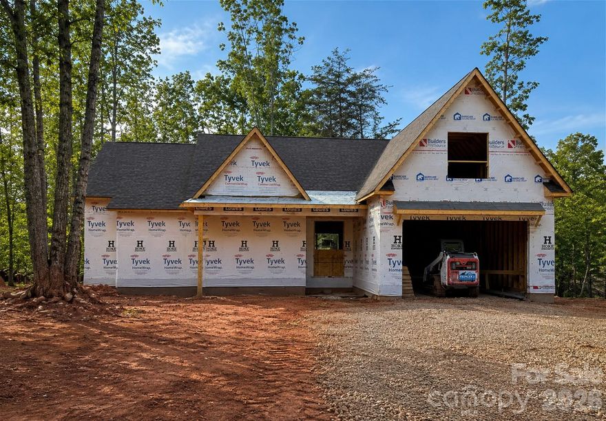 This beautiful 4 bedroom, 4 full bath, new construction home blends modern farmhouse charm with upscale craftsmanship in a peaceful wooded setting. The exterior features a striking combination of steep front-facing gables, a 10 x 33 oversized covered rear porch and spacious front porch that creates a warm and inviting curb appeal. Large two-car garage, and a dramatic upper-level bonus and flex space framed by the oversized dormer. The tall rooflines and multiple peaks give the home a custom-built luxury appearance while maximizing interior ceiling height and natural light. Set on a gently sloping homesite surrounded by mature trees, the property offers privacy and a serene atmosphere while still feeling open and spacious. The septic system has been designed to leave room for a pool and can be added for an additional fee. This home is ideal for buyers seeking: Open-concept living spaces, Large entertaining areas, bonus/media room upstairs with a full bath, Custom finishes and designer detail!