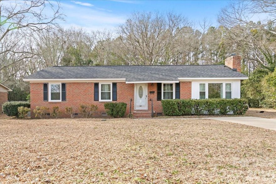 This fully updated 3-bedroom, 2-bath home is located on a charming street in Bennettsville. Truly move-in ready, this one features original hardwood floors, an updated kitchen with newer appliances and endless storage, updated bathrooms, a new roof, and more! The primary bedroom has its own private bathroom, while the secondary bedrooms are spacious with nice closet space, too. Sitting on close to half an acre with a paved drive and a low maintenance yard, this is one that certainly offers a perfect blend of character, updates, and great space both inside and out!