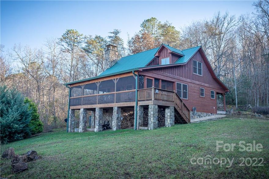 Experience tranquility in this cozy log cabin with stunning views, porch living and great yard to garden or play in the desirable Webster community.  Features stacked stone woodburning fireplace, hickory kitchen cabinets, granite countertops and screened in porch. Tucked away for end of road privacy and adjoins 100 acres of woodlands. Convenient to everything the mountains have to offer. This is a must see and please no drivebys.