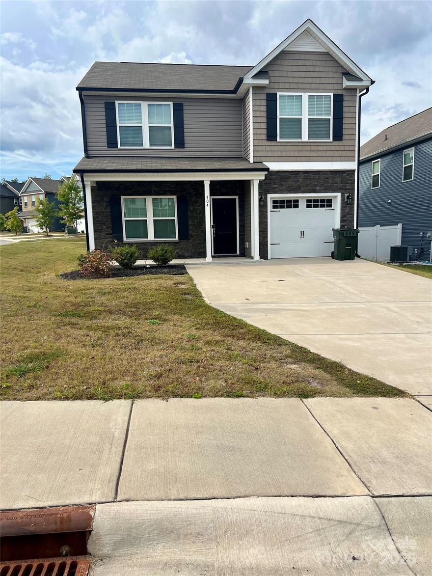 Welcome home to this beautifully designed 4-bedroom, 2.5-bath modern home built in 2022, perfect for today’s busy family! Step inside to a bright and open floor plan that offers plenty of space for gathering and making memories. The spacious living room flows easily into the dining area and modern kitchen, complete with quartz countertops, stainless steel appliances, a large center island, and ample cabinet space — ideal for family meals and entertaining.