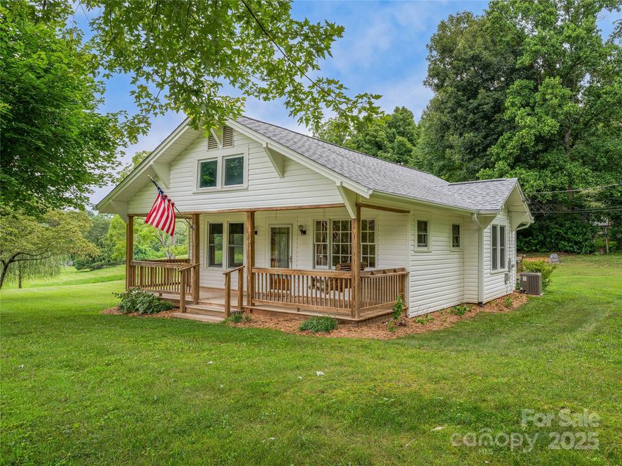 Enjoy the charm of country living minutes from the energy of Asheville! This beautifully updated home offers a rare blend of classic character and modern updates. Located only 4 minutes to Ingles Grocery, 9 minutes to Patton Avenue, and less than 15 minutes to downtown Asheville, you’ll love the easy access to shopping, dining, and entertainment. Inside, rich wood floors bring warmth to the space while tasteful updates throughout enhance comfort and style. The kitchen features a gas range perfect for home chefs, and the washer and dryer are included for your convenience. The sealed crawl space provides additional storage options, and the recently inspected and pumped septic system offers peace of mind. A 3-car carport with extra storage adds valuable functionality, while the spacious yard and ample parking make this home ideal for entertaining and everyday living. Discover timeless appeal with thoughtful upgrades in a location that offers a lush green yard with proximity to everything.