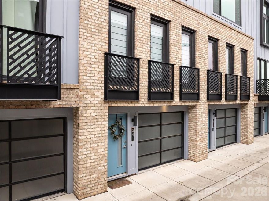 Beautiful townhome with garage right in the heart of South End and in the middle of all the restaurants and shopping. This one looks brand new and has only had 1 owner!! Domain townhomes do not come up frequently and there are only a select few townhomes in South End with garages. This stunning home has 2 Bedrooms, 1.5 Baths and was built in 2018. Engineered hardwood flooring throughout the main living areas and carpet in bedrooms. The lower level was built with a bedroom, back courtyard entrance and attached garage with storage space. Main level features include a large open family room with small Juliette balcony overlooking the front courtyard, dining space, open kitchen with beautiful quartz countertops and island seating and a half bath. The top level is where you will find the Primary Suite and Laundry Room. The primary bedroom with walk-in closet takes up one half of the space and the huge primary bathroom with dual vanities and large walk-in shower takes up the other side of this floor with a laundry room in the middle to complete the top level. 

HOA fee includes roof, exterior maintenance/painting, private drive maintenance and also includes the monthly water bill.