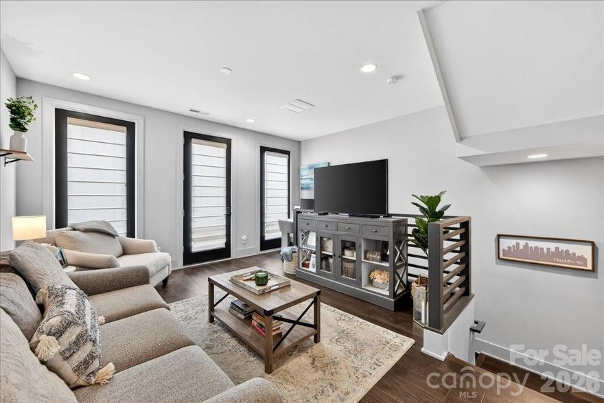 Beautiful townhome with garage right in the heart of South End and in the middle of all the restaurants and shopping. INVESTOR FRIENDLY! This one looks brand new and has only had 1 owner. Domain townhomes do not come up frequently and there are only a select few townhomes in South End with garages. This stunning home has 2 Bedrooms, 1.5 Baths and was built in 2018. Engineered hardwood flooring throughout the main living areas and carpet in bedrooms. The lower level was built with a bedroom, back courtyard entrance and attached garage with storage space. Main level features include a large open family room with small Juliette balcony overlooking the front courtyard, dining space, open kitchen with beautiful quartz countertops and island seating and a half bath. The top level is where you will find the Primary Suite and Laundry Room. The primary bedroom with walk-in closet takes up one half of the space and the huge primary bathroom with dual vanities and large walk-in shower takes up the other side of this floor with a laundry room in the middle to complete the top level. 

Light rail access directly across the street from the community and a new light rail stop is being added at South End Station by the Publix in the near future.

HOA fee includes roof, exterior maintenance/painting, private drive maintenance and also includes the monthly water bill.