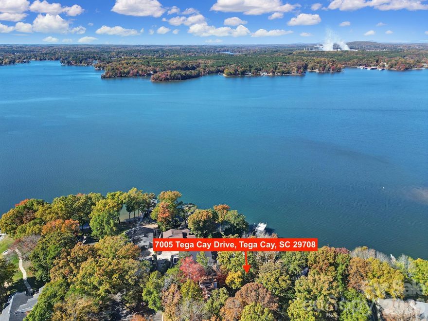 Welcome to this Rare Piece of Lake Wylie History! Discover endless possibilities with this spacious home situated on a half acre double lot right on the shores of Lake Wylie, complete with its own dock and stunning big water, main channel views. Originally owned by prominent Civil Rights Attorney Julius Chambers and then updated by renowned Architect and Mayor of Charlotte Harvey Gantt. Home also has an oversized 2 car garage with additional assigned parking spots in the culdesac. Brimming with character and charm, this property offers a unique opportunity to update and personalize a true classic as it was one of Tega Cay's first "model homes" — creating your dream lakeside retreat. Enjoy the serenity of waterfront living with the convenience of being in a top-rated school district and close to shopping, dining, and all that the area has to offer including the neighboring marina and nearby golf course and sport courts. Homes like this don't come available all that often so embrace the chance to own a piece of Lake Wylie history and make it your own! Kitchen and bathrooms have all been updated with custom built ins at the primary closet. Dual primary suites on opposite ends of the house. No HOA! House is currently listed well below our recent appraisal as seller is motivated and not looking to do any repairs as they no longer live in the area and haven't lived in the home for a few years now.